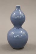 A small Chinese blue porcelain double gourd vase. 11 cm high.