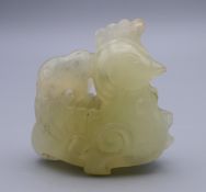 A Chinese carved jade chicken. 5 cm high.