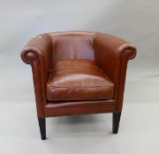 A modern leather tub chair. 78 cm wide.