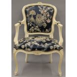A Louis XV style upholstered open armchair. 57 cm wide.