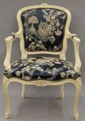 A Louis XV style upholstered open armchair. 57 cm wide.