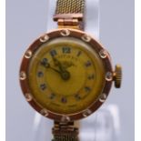 A 9 ct gold cased Rotary ladies wristwatch. 2 cm wide. 15.7 grammes total weight.