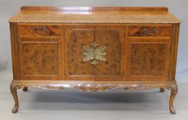 A 20th century burr walnut dining suite with Beresford & Hicks;