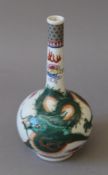 A small Chinese porcelain straight neck dragon vase. 16 cm high.