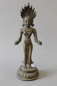 An antique Indian bronze model of a deity. 32 cm high.