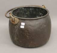 A 19th century copper cauldron. 35 cm wide.