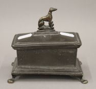 A 19th century bronze and lead casket. 14 cm long.