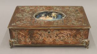 A 19th century French copper jewellery box, the lid set with a miniature. 24.5 cm wide.