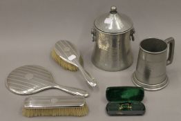 A silver dressing table set, two pieces of pewter and a pair of spectacles.