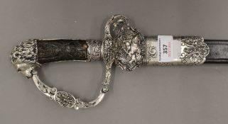 A hunting hanger, the scabbard and handle with silvered mounts. 80 cm long.