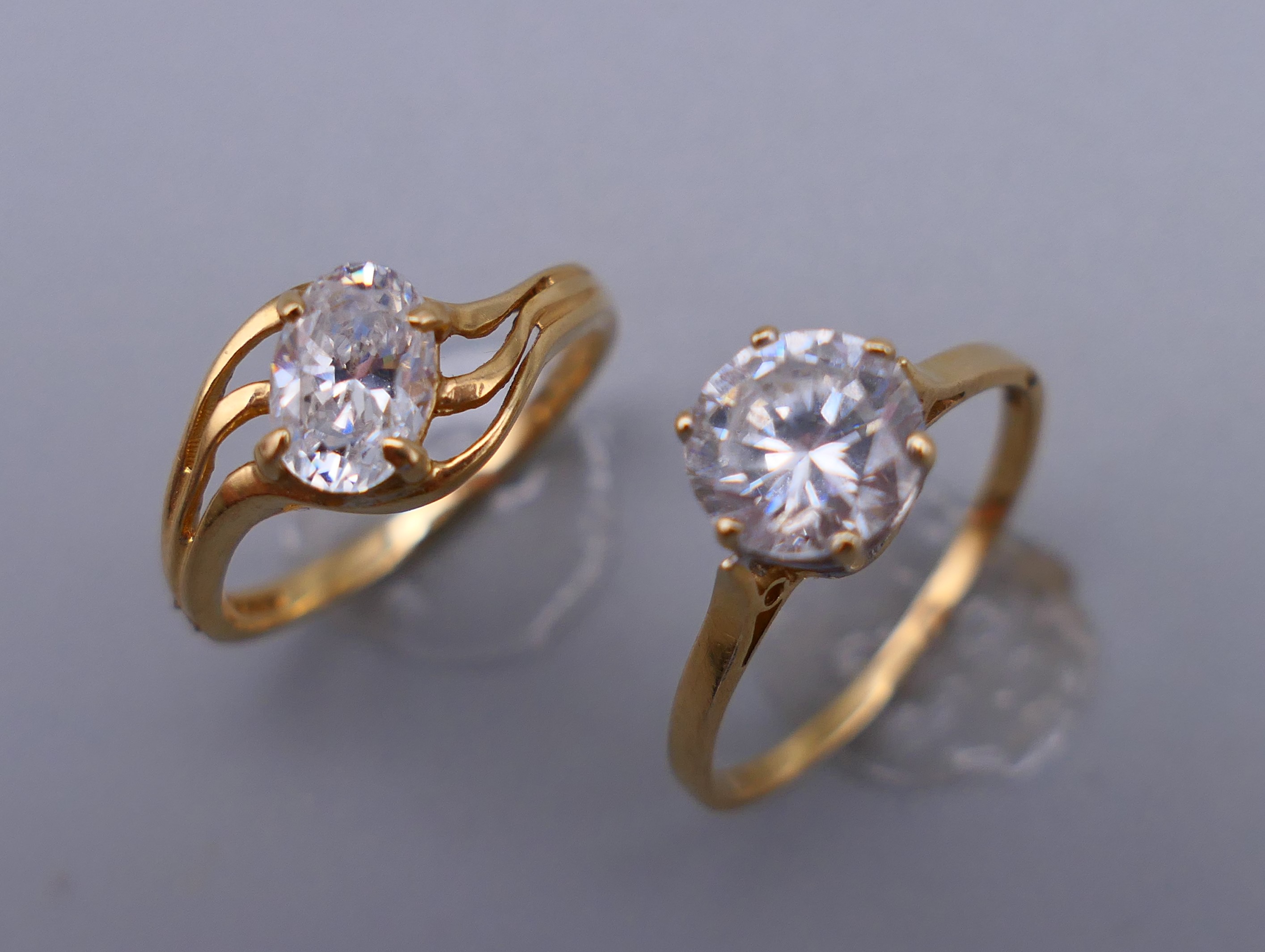 A 14 ct gold ring (1.8 grammes total weight) and a 9 ct gold ring (2 grammes total weight).