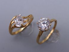 A 14 ct gold ring (1.8 grammes total weight) and a 9 ct gold ring (2 grammes total weight).