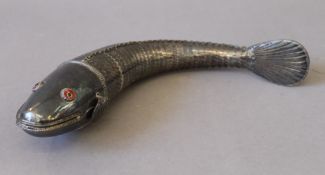 A unmarked silver articulated model of a fish. 28 cm long.