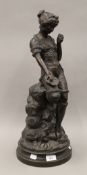 A late 19th/early 20th century bronze figure of a young girl, inscribed Gustave Rey. 57 cm high.