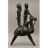 An African bronze group of two musicians riding a camel. 41.5 cm high.