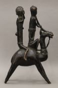 An African bronze group of two musicians riding a camel. 41.5 cm high.