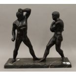 A pair of patinated bronze models of gladiators mounted on a marble plinth base. 40 cm long.