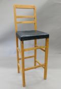 An early 20th century beech clerk's high chair. 115 cm high.