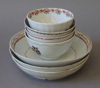 Three Chinese Export tea bowls, three Export saucers and a tea bowl.