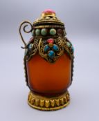 A Tibetan agate and turquoise snuff bottle. 8 cm high.