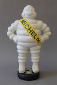 A cast iron Michelin Man figure. 37 cm high.