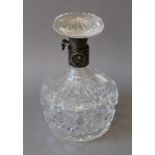 A Hukin and Heath locking silver collared cut glass decanter. 20 cm high.