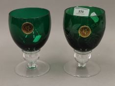 A pair of Royal Scot crystal glasses, one engraved. Each 14 cm high.