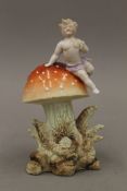 A 19th century porcelain spill vase formed as a putto on a toadstool. 12.5 cm high.