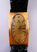 A 14 K gold Omega wristwatch. 2 cm wide. 23.2 grammes total weight.