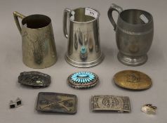 Three tankards, five belt buckles (including two silver examples) and two pairs of cufflinks.