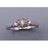 A silver diamond set cluster ring. Ring size L/M.