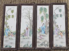 A set of four framed Chinese porcelain plaques. 27 x 80 cm.