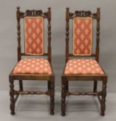 A pair of early 20th century oak chairs. 45 cm wide.