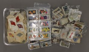 A quantity of cigarette cards and cigarette silks.