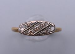 An Edwardian 18 ct gold diamond set navette ring. Ring size P/Q. 2.2 grammes total weight.