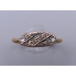 An Edwardian 18 ct gold diamond set navette ring. Ring size P/Q. 2.2 grammes total weight.