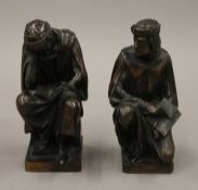 A pair of patinated bronze models of scholars. Each 12.5 cm high.