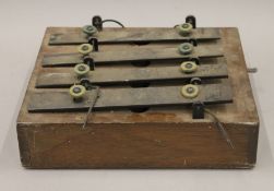 An unusual vintage oak cased instrument. 29 cm wide.