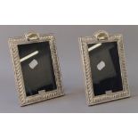A pair of silver photograph frames. 13.5 x 19.5 cm.