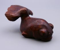 A Japanese netsuke formed as a fish. 6.5 cm long.