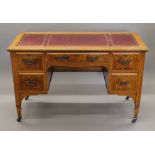 A Victorian writing table. 121 cm wide.