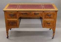 A Victorian writing table. 121 cm wide.