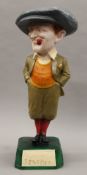 A reproduction Penfold advertising golfing figure. 50 cm high.