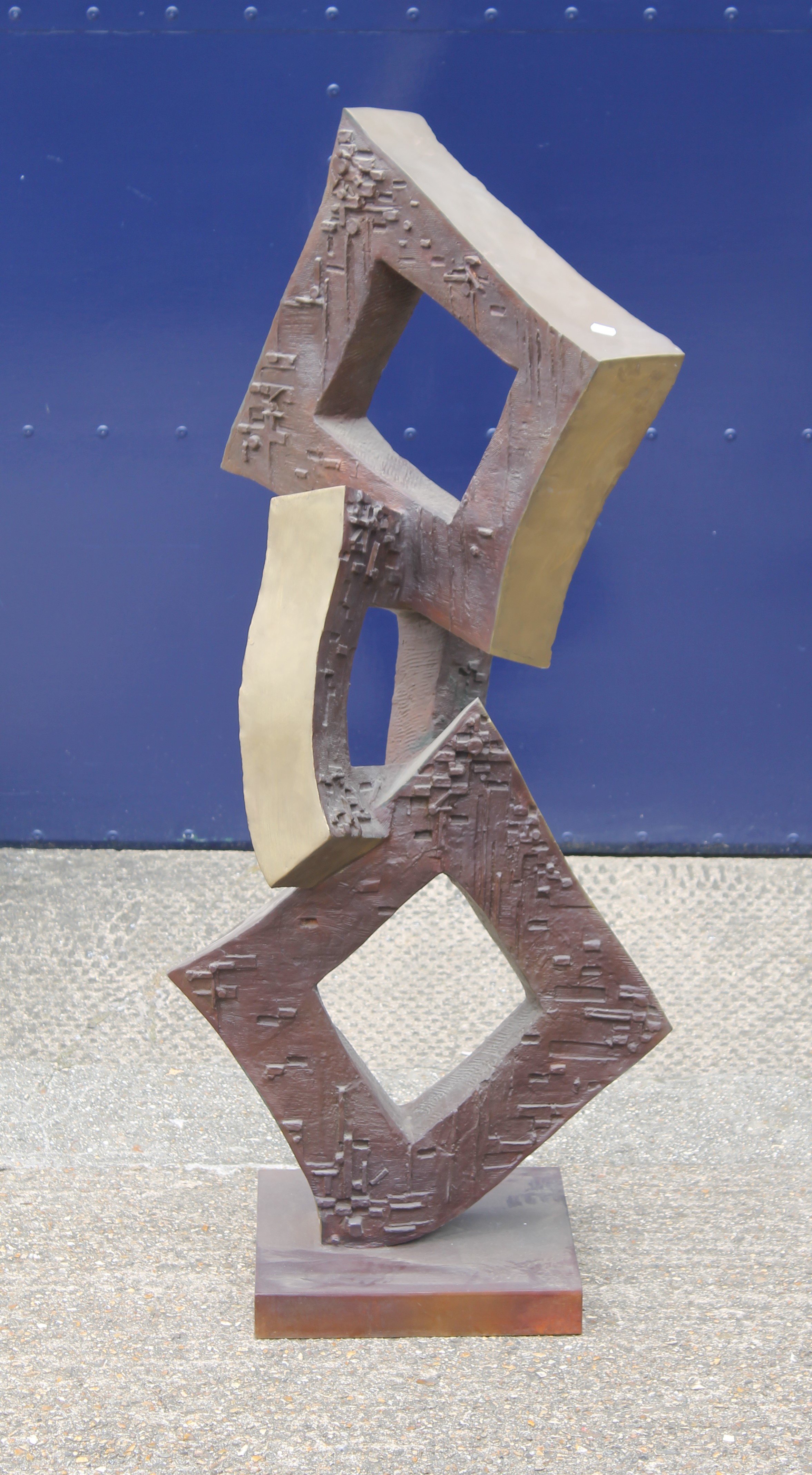 A large bronze abstract square sculpture. 131 cm high.