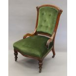A Victorian upholstered walnut framed nursing chair. 56 cm wide.