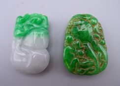 Two jade pendants. The largest 5 cm high.