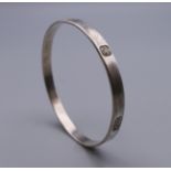 A silver hallmarked bangle. 20.6 grammes.