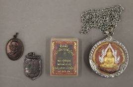 A collection of Thai amulets.