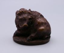 A signed Japanese bronze model of a boar. 3 cm high.