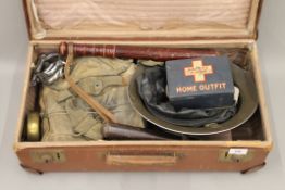 A quantity of military and Special Constable items, including a truncheon, a helmet and handcuffs.